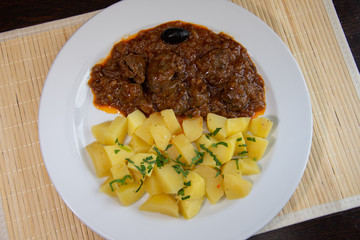 Liver with onion sauce and Pork chop with nature potatoes