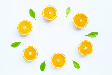High vitamin C, Juicy and sweet. The round frame made of fresh orange fruit with leaves on white background.