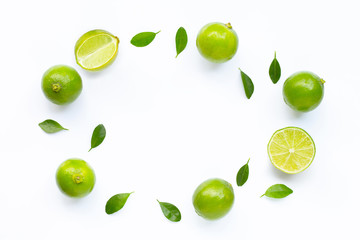 Limes with leaves isolated on white.