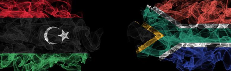 Flags of Libya and South Africa on Black background, Libya vs South Africa Smoke Flags
