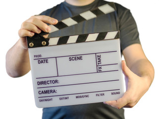 closed movie clapper board in a man hands isolated  on a white background