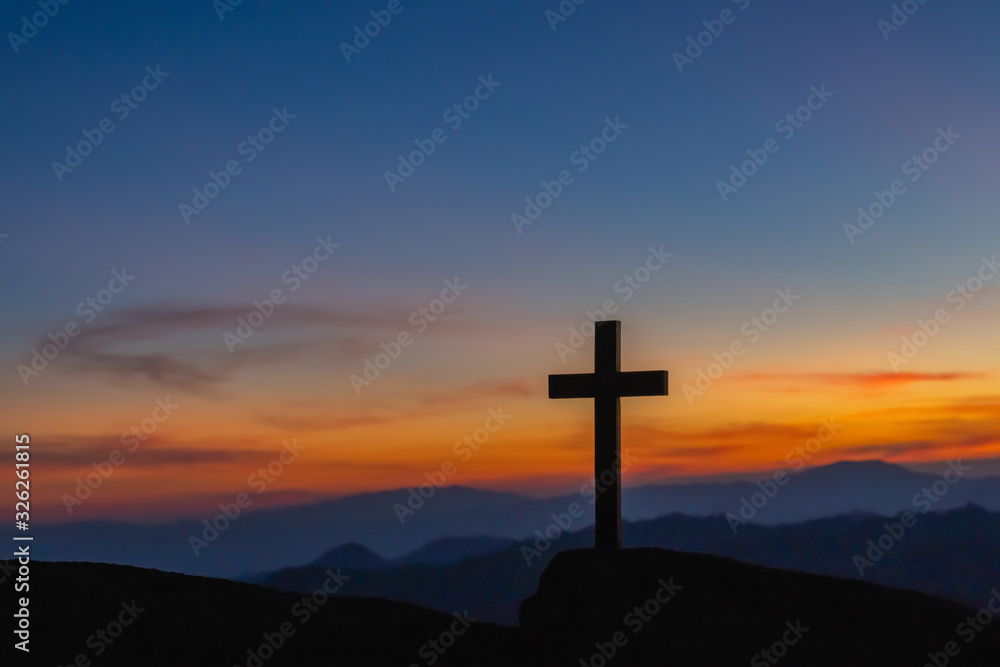 Wall mural the silhouette of the crucifixion of jesus christ - crossing at sunset