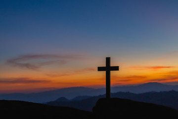 The silhouette of the crucifixion of Jesus Christ - crossing at sunset