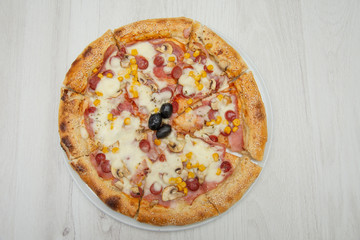 Pizza four friends, with olives and cheese