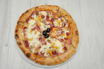 Pizza four friends, with olives and cheese