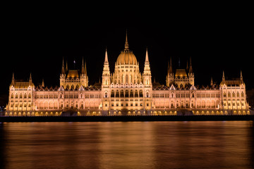 Fototapeta na wymiar Night view of Hungarian Parliament Building on the banks of the Danube, Budapest, Hungary