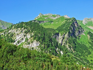 View of the picturesque peaks of the Liechtenstein Alps mountain massif from the Naaftal alpine...