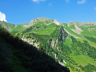 View of the picturesque peaks of the Liechtenstein Alps mountain massif from the Naaftal alpine...