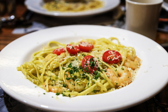 Homemade Pesto Linguine Pasta With Sauteed Prawns In Alfredo Sauce