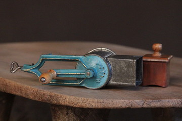 old kitchen grater tool on wooden board