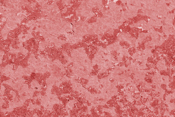 Old asphalt surface close up. Abstract background red color toned