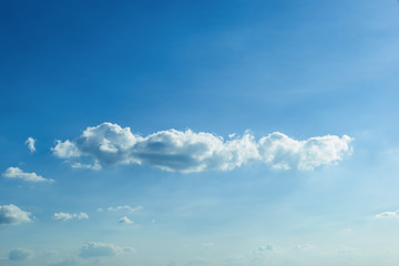 fluffy cloud above clear blue sky