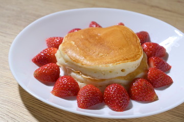 pancake and strawberry fruit sweet dessert food put on breakfast table