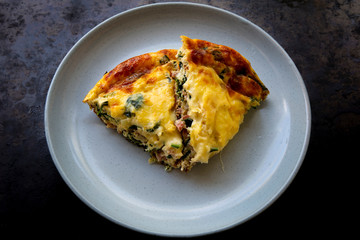 Frittata made of eggs, bacon, cheese and spinach