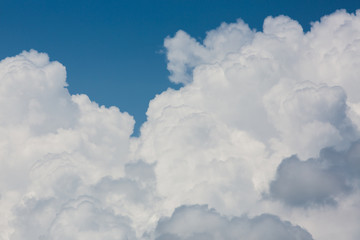 Naklejka na ściany i meble fluffy white cloud on dramatic sky