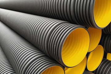 black construction pipes. corrugated pipes coated inside yellow