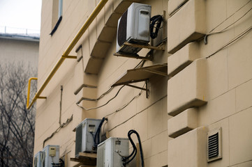 Air conditioners on building wall