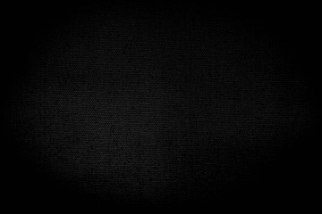 The texture of the dark black canvas for the background design image