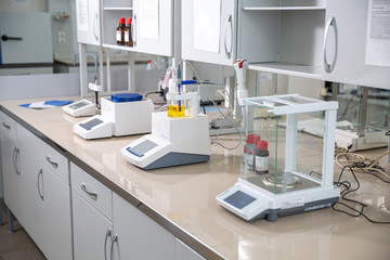 analytical scales in a chemical laboratory, good daylight,