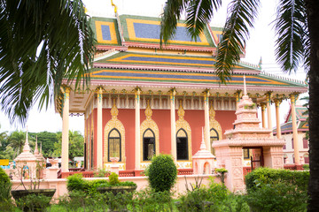Fototapeta premium pink asian thai temple with a colorful roof 