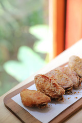 Fried chicken on wood background