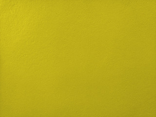 Concrete  mustard  wall  background  with  copy  space.
