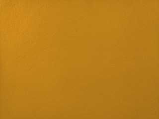 Concrete  tawny  wall  background  with  copy  space.