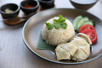 Thai food gourmet steamed chicken with rice , khao mun kai in wood background