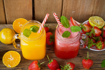 strawberry juice in glass on wooden table