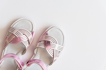 Baby girl pink sandals isolated on background. Baby fashion pair pink sandals shoes for the toddlers feet .
