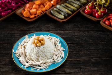 Turkish traditional street food chicken and rice with chickpeas. Tavuklu pilav concept