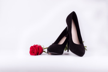 Black stilettos and red rose