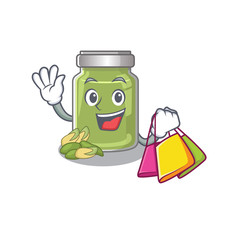 A friendly rich pistachio butter waving and holding Shopping bag