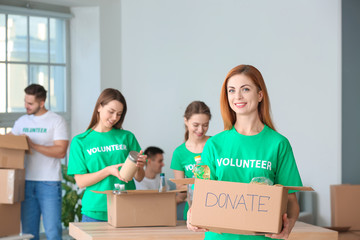 Team of volunteers with products indoors