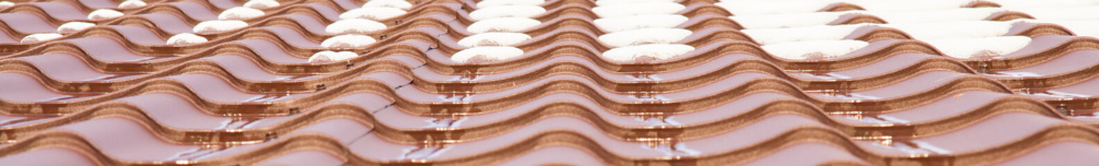 Metal roofing in the rain and snow