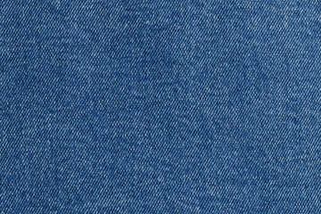Top view on blue denim. Abstract modern trendy fabric texture background