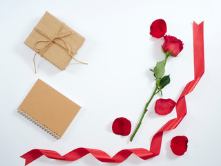 Single red rose and gift box.