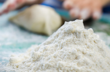 Close up of young woman hands making traditional dishes in the home kitchen