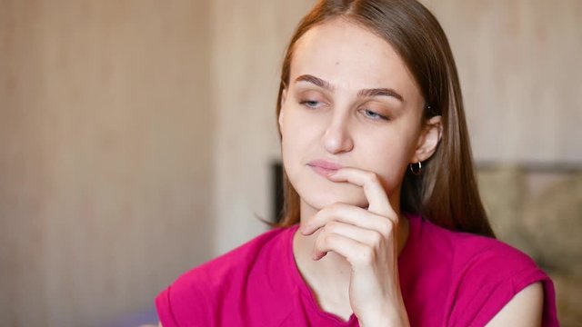 European girl in thought and smirk plans