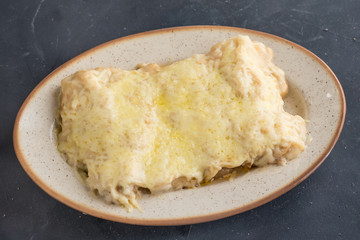 Canelones (cannelloni) with meat filled pasta on a plate