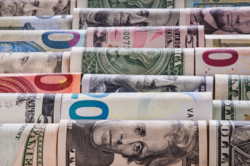 Background of twisted dollar and euro banknotes