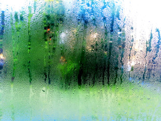 Condensation on the clear glass window. Water drops. Rain.