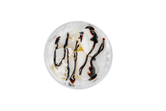 Four Balls Ice Cream Dessert, Vanilla Flavor, With Chocolate Topping, Isolated On A White Background In Creamer On A Plate With A Spoon And A Napkin, View From Above For Menu