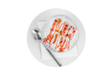 four balls Ice cream dessert, vanilla flavor with strawberry, berry topping, isolated on a white background in creamer on a plate with a spoon and a napkin, view from above for menu