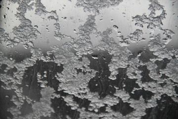 Fototapeta premium Snow flakes on a roof window