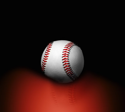 Baseball ball on a black background with reflection on red