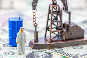 Crude oil price and petroleum demand concept :  Arab men in white thawbs negotiate on a trade deal...