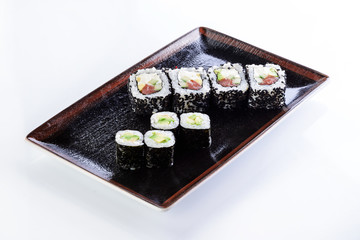 sushi rolls in a plate on a light background set