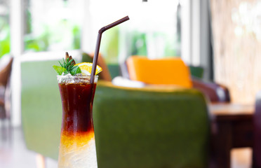 Cold brew coffee with orange juice at cafe.