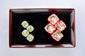 sushi rolls in a plate on a light background set